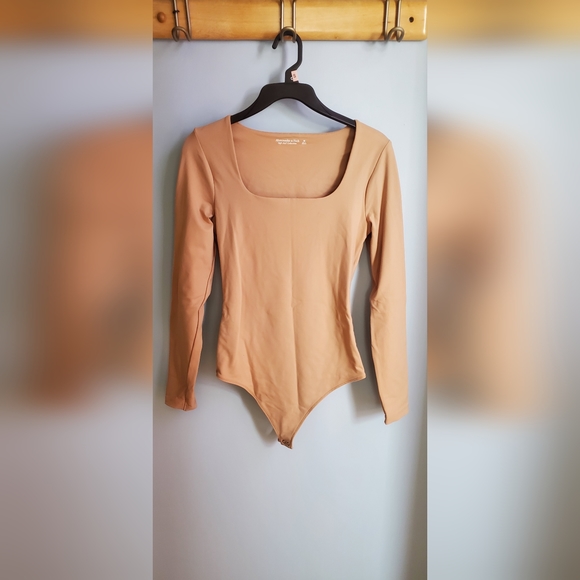 Abercrombie & Fitch Tops - Tan Abercrombie bodysuit medium
